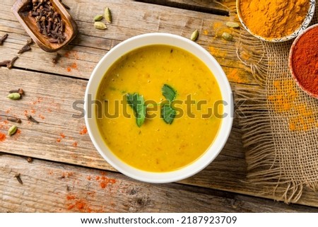 Spicy Lentil Soup on bowl, indian cuisine on old wooden table top view Royalty-Free Stock Photo #2187923709