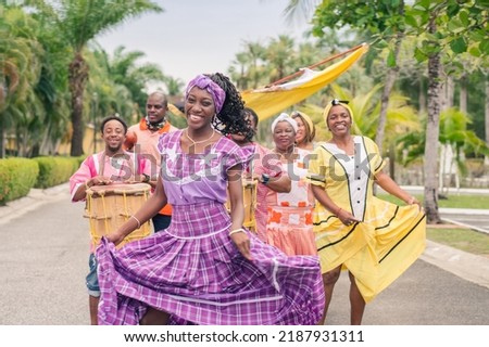 A Group of African American people dancing and playing Latin music. Royalty-Free Stock Photo #2187931311
