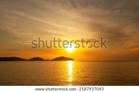 Landscape Long exposure of majestic clouds in the sky sunset or sunrise over sea with reflection in the tropical sea.Beautiful cloudscape scenery.Amazing light of nature Landscape nature background Royalty-Free Stock Photo #2187937043