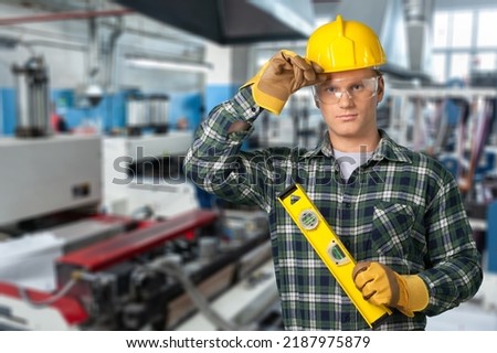 Happy young engineer or repairman showing sign or hand gesture. Concept of professional,