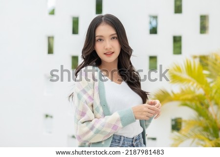 Beautiful asian young woman smile and cheerful. Confident cute female looking at camera relax and happiness with wellness life. good moment and positive emotional. Happy woman enjoy her life concept Royalty-Free Stock Photo #2187981483