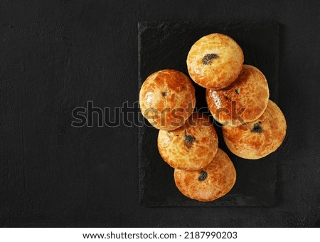 Traditional Christmas Austrian pies Mohnzelten with poppy seeds filling on dark table, top view