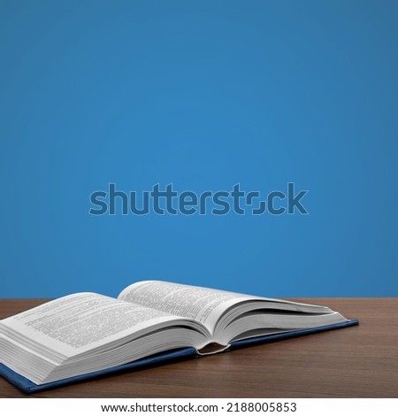Old retro book is open. Holly book concept Royalty-Free Stock Photo #2188005853