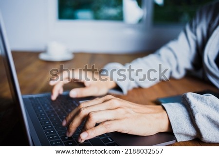 Hand People are using keyboards to search and scroll through laptops and search on online website