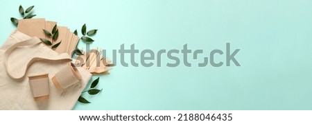 Eco friendly products on light blue background, top view with space for text. Banner design