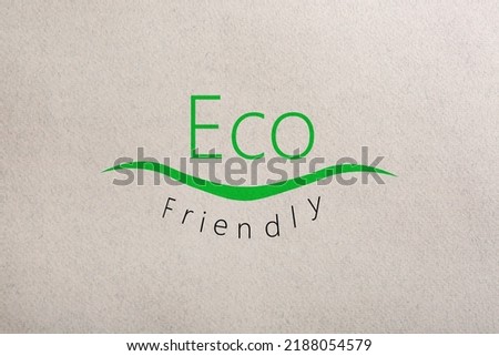 Phrase Eco Friendly written on recycled paper, top view