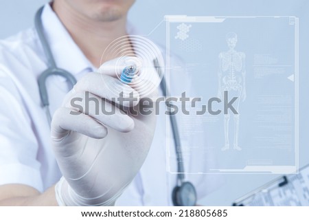 Doctor pointing pen toward digital screen about ebola  Royalty-Free Stock Photo #218805685