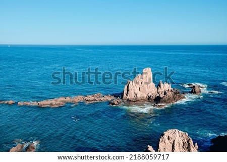sunset of the reef of the sirens, in Cabo de Gata, Almeria, Spain where you can see ancient volcanic lava chimneys millions of years old in the Mediterranean Sea Royalty-Free Stock Photo #2188059717
