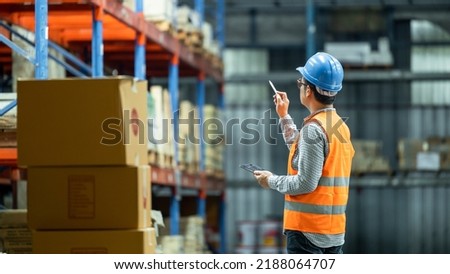 Warehouse asian worker working in warehouse stock checking inventory production stock control , Warehouse control and management business factory industry logistics warehouse people, .Asia
