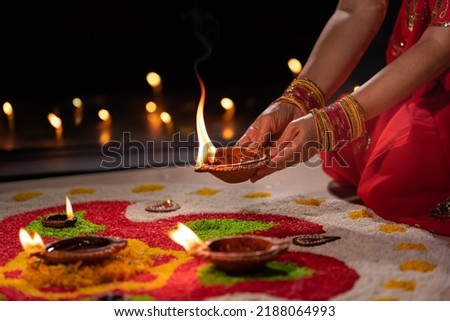 Traditional diya lamps lit during diwali celebration Royalty-Free Stock Photo #2188064993