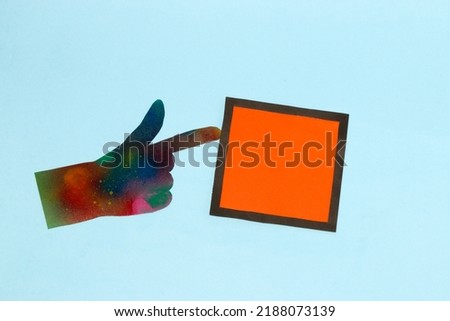 abstract art futuristic hand pointing at black-orange frame as copy space, creative art design on blue background
