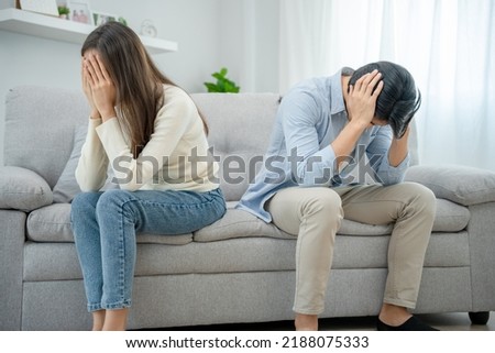 Divorce. Asian couples are desperate and disappointed after marriage. Husband and wife are sad, upset and frustrated after quarrels. distrust, love problems, betrayals. family problem, teenage love Royalty-Free Stock Photo #2188075333