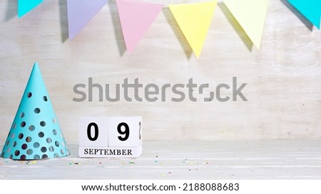 Birthday September 9 on the calendar. Happy birthday card with date copy space. Holiday decorations for congratulations, place for text.
