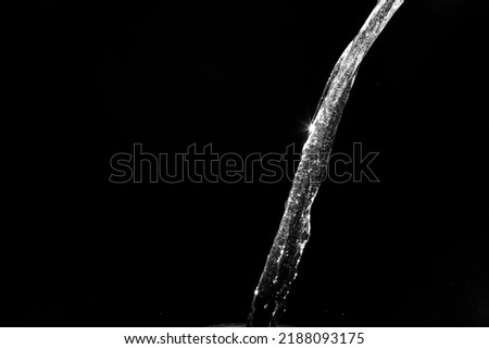 water splashes isolated on black background. white jets with drops. High quality photo Royalty-Free Stock Photo #2188093175