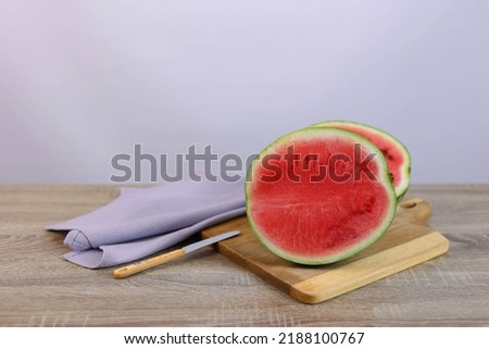 cut watermelon lies on the board. High quality photo