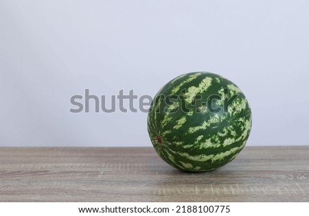 watermelon lies on a wooden table. High quality photo