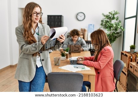 Group of business workers working at the office. Royalty-Free Stock Photo #2188103623
