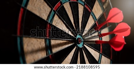 red darts in the dartboard center. business target or goal success and winner strategy concept. banner with copy space Royalty-Free Stock Photo #2188108595