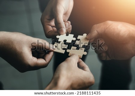 mobile jigsaw puzzle pieces business cooperation concept teamwork and cooperation Businessmen join a jigsaw team, charity, volunteerism, unity, teamwork. Royalty-Free Stock Photo #2188111435