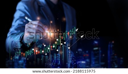 Business man planning to invest in stock market. man touching success goals icon on virtual screen, stock graph is rising, economy is recovering, stock trading, business start up, business success.