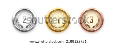 Gold, silver, bronze medal set. Champion trophy awards with numbers and laurel vector illustration. Prize in sport for winning first, second, third place in competition on white background. Royalty-Free Stock Photo #2188122921