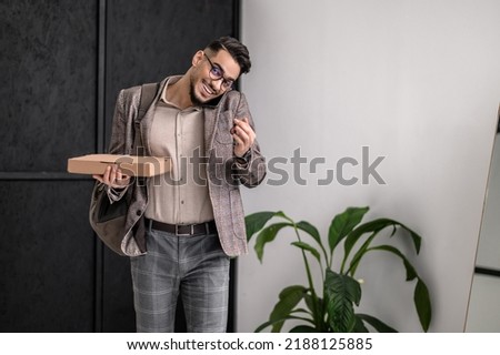 Man looking at camera talking on smartphone