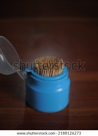 Toothpick on the wooden table or tusuk gigi dari bahan bambu diatas meja makan