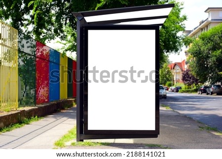 bus shelter at busstop. transit station. blank white billboard ad sign and lightbox. bus shelter advertising. soft background. glass and aluminum structure. white poster ad commercial poster display Royalty-Free Stock Photo #2188141021