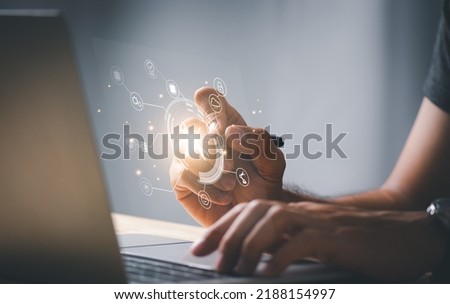 man use Laptop and writing with Maintenance sign wrench and srewdriver tools icon. Technical support concept. Royalty-Free Stock Photo #2188154997