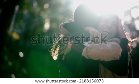 Two best friends reunion. Female friendship hug and embrace. Friends hugging girlfriend outdoors in sunlight. Real life love Royalty-Free Stock Photo #2188156073