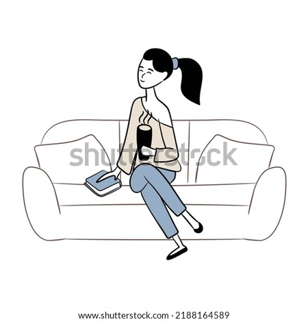 A woman is drinking coffee and reading a book on the couch. Enjoy the peace and quiet at home. Concept of homeward and comfort. Coffee and book. Relax and calm down. Cup of hot drink in hands. Royalty-Free Stock Photo #2188164589