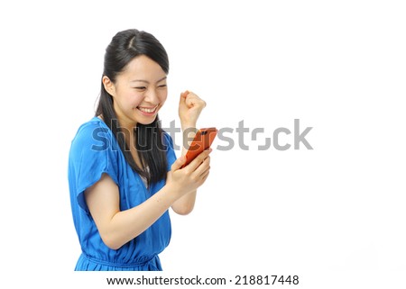 Beautiful young asian woman who see a smart phone