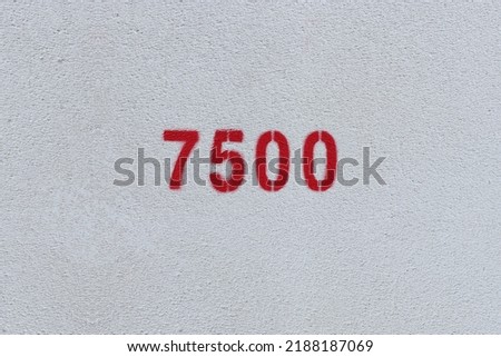 Red Number 7500 on the white wall. Spray paint.

