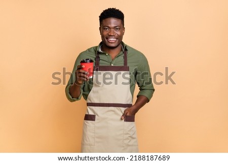 Photo of guy hold latte beverage mug cafe client buy wear shirt isolated on pastel color background