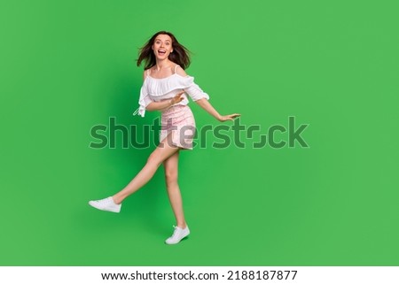 Full size photo of overjoyed positive girl have fun dance clubbing isolated on green color background Royalty-Free Stock Photo #2188187877