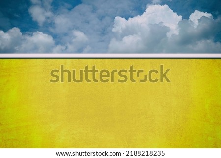 Fortuna Gold Grunge Wall with Dark Blue Sky Background.