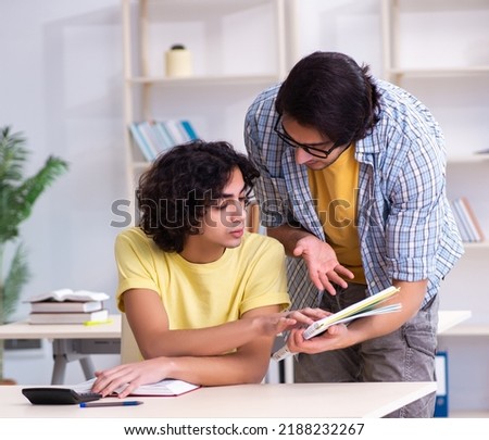 Two male students in the classroom Royalty-Free Stock Photo #2188232267