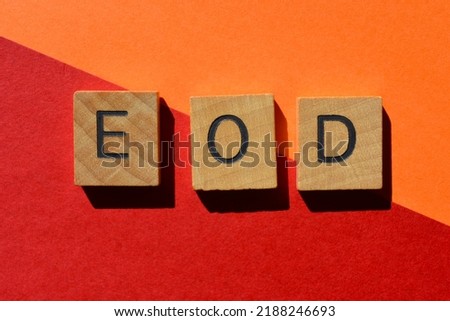 E O D, abbreviation for End Of Day, in wooden alphabet letters isolated on background