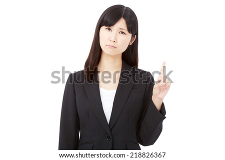 concerned Japanese businesswoman pointing side