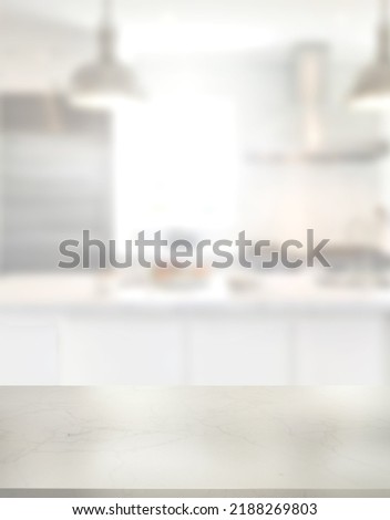 Empty marble desk on blurred kitchen window for product presentation. Stylish marble table top with copy space for your design at blurry kitchen.