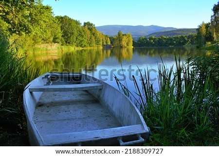 Boat in the lake, sunny day.