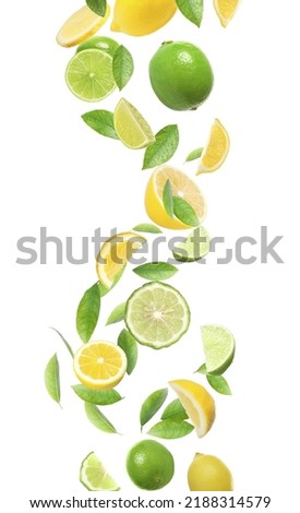 Fresh juicy citrus fruits and green leaves falling on white background Royalty-Free Stock Photo #2188314579