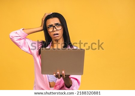 African american black woman using laptop isolated over yellow background tired feeling fatigue and headache. Stress and frustration concept.
