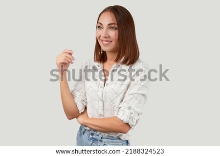 Beautiful woman in casual clothes posing over white background