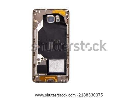 Back side of a broken phone on a white isolated background