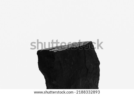 A Single Rock Boulder, Showing a Sun Lit Top Ledge with Close Detail to the Natural Indents of the Ancient Stone, Isolated on a White Background. Royalty-Free Stock Photo #2188332893