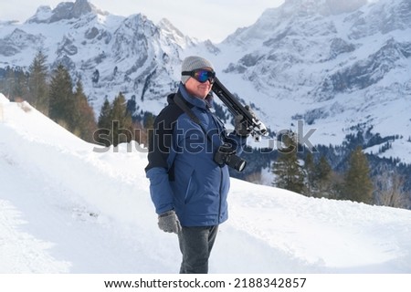elderly man with camera, mountain hiker admiring mountain winter landscape, Sports Concept, Healthy Lifestyle, Winter Activity, beautiful winter natural landscape, walks in winter white forest