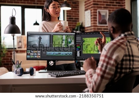 Creative couple making movie on editing software, creating professional video content on multimedia post production app. Working on film montage and footage with color grading effects.