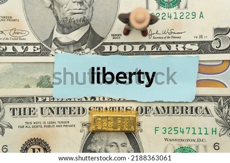 liberty.The word is written on a slip of paper,on colored background. professional terms of finance, business words, economic phrases. concept of economy.