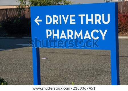 Drive thru pharmacy sign with arrow